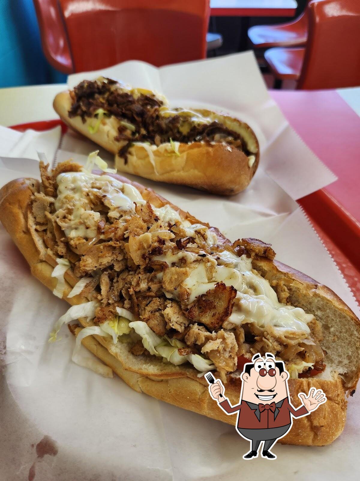 Two loaded cheesesteak subs with fried onions from Sinbad's, Ocean City MD
