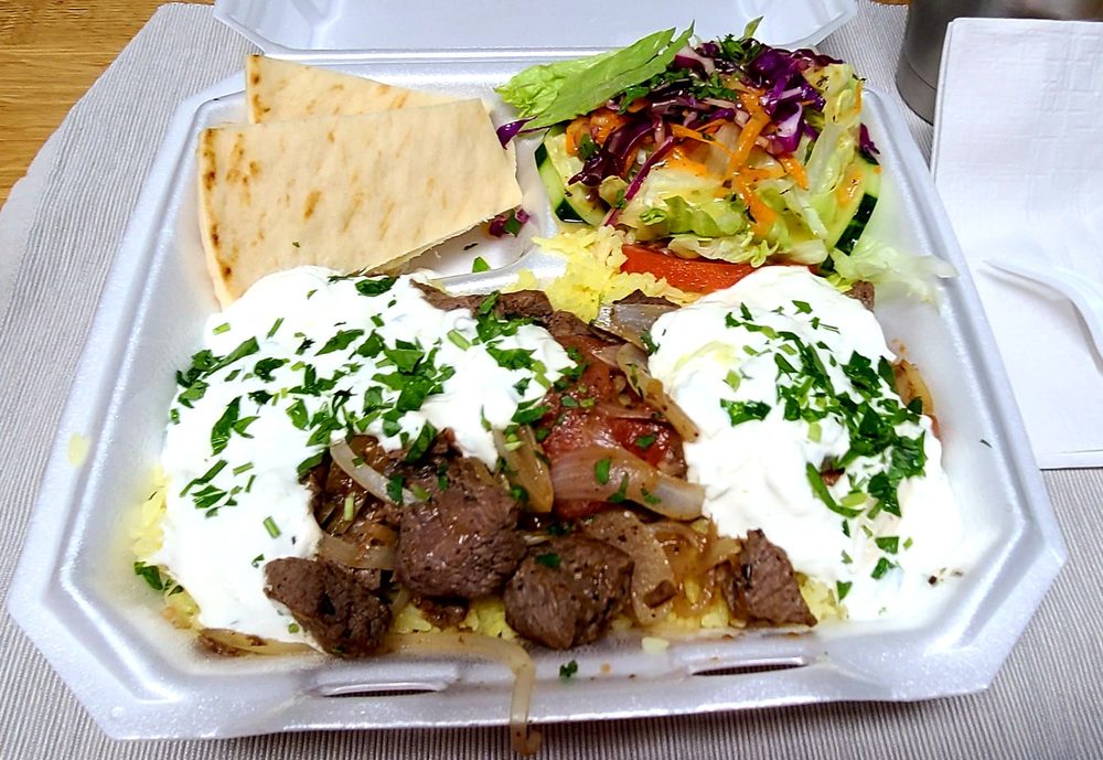 Sinbad's gyro platter in Ocean City, MD — gyro meat over rice with pita, salad and tzatziki
