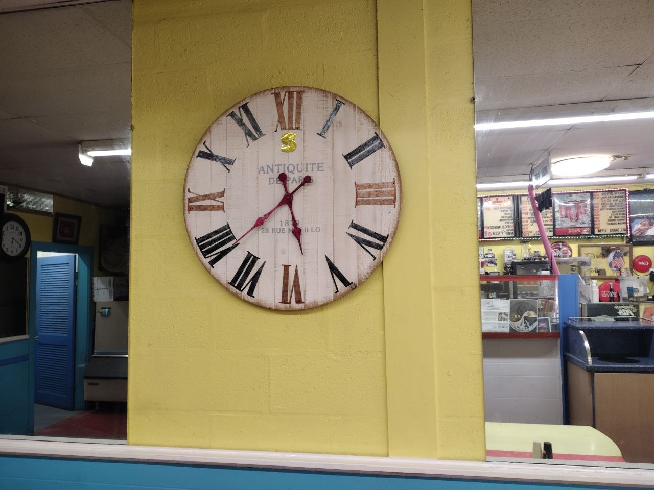 The antique Antiquité de Paris wall clock inside Sinbad's, Ocean City, MD