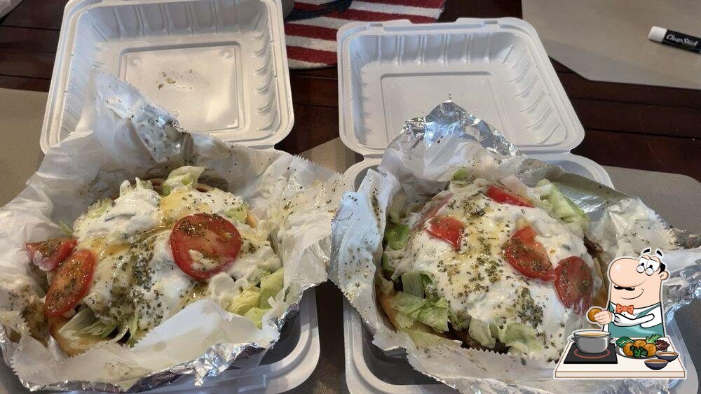 A fresh slice of Sinbad's hand-tossed pizza being lifted, Ocean City MD